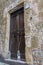 The ancient custom of putting plastic bottles full of water outside the front door to keep cats away, Sorano, Italy