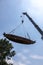 Ancient decaying wooden boats are being moved by cranes and wire ropes