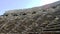 Ancient dilapidated amphitheater with stone seats