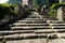 Ancient dilapidated stairs among ancient ruins in mountains