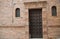 Ancient door in the city of Deruta decorated with raw ceramic