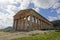 Ancient Doric temple of Segesta which is under reconstruction in sunny spring day with blue sky and perspective view