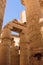 Ancient Egypt. The columns are decorated with carved hieroglyphs. Karnak Temple.