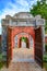 Ancient entrance gates with red doors to the Citadel. Imperial City Hue, in the Forbidden City of Hue.