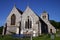 Ancient flint church, deep blue sky