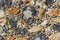 Ancient flint stone wall surface close-up. Abstract background i