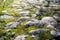 Ancient footpath from block stones from medieval age, texture stones, background of old stones. Old pavement.