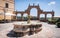 Ancient Fountain and arches in Repubblica square, in Pitigliano