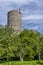 The ancient Frohlich Tower in the historic center of Malles Venosta, South Tyrol, Italy