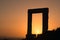 Ancient gate of Apollon temple at sunset on Naxos island