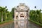 Ancient gate of a Buddhist temple in Snake village (Le Mat snake village). Hanoi, Vietnam