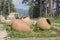 Ancient giant clay waterpots against the backdrop of the Osogovo Mountains.