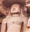 Ancient giant Jain statue carved out of rock in Gwalior, Madhya Pradesh, India