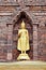 Ancient golden Buddha\'s staue with brick pogoda