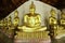 Ancient golden buddhas in the Thai buddha temple church