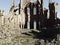 Ancient gothic stone architecture ruins with gargoyle statues interior view.