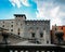 Ancient gothic window facade with a waving flags of Catalonia Catalunya known as Senyera, captured in Girona, Spain. The