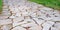 Ancient granite paving. Close-up view from above. Pavement.