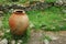 Ancient greek jug on green grass