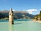 Ancient half-submerged bell tower in Graun im Vinschgau