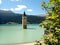 Ancient half-submerged bell tower in Graun im Vinschgau