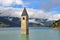 Ancient half-submerged bell tower in Graun im Vinschgau