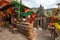 Ancient Hindu stone temple with street shops selling religious items at Bageshwar Uttarakhand India