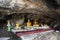 Ancient holy buddha statue in antique mystery cave for thai people travel visit respect praying blessing luck wish of Wat Khao