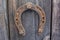 Ancient horseshoe on a old wooden background