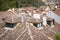 Ancient house roofs, chimneys and antennas in a village