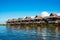 Ancient houses and their reflection in the water on the Inle Lake