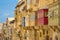 Ancient houses and traditional colorful balconies of Valletta