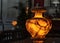 Ancient illuminated alabaster vase shows the face of Medusa and numerous cracks