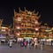 Ancient illuminated mansion at night in Shi Zi Ling area, Shanghai, China