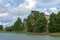 Ancient Kastelholm Castle 14th century on green shoreline of lake, Aland islands