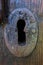 Ancient keyhole of a vintage wood door.