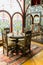 Ancient Khans or kings room interior with network ornamental window, Table and chairs.