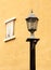Ancient lamppost with vintage window