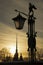 Ancient lantern with an arrow and the silhouette of the Peter and Paul Cathedral