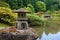 Ancient Lantern on the pond in japanese garden