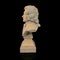 Ancient marble bust of a general isolated on black background.