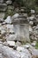 Ancient marble statue pedestal among the ruins of abandoned city Termessos in Turkey mountains