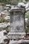 Ancient marble statue pedestal among the ruins of abandoned city Termessos in Turkey mountains