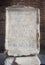 Ancient marble tablet engraved with the Venantius incription inside the Colosseum in Rome, Italy