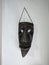 Ancient mask hanging at wall