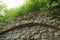 Ancient masonry in the form of an arch in the natural pack Bastei, Germany.