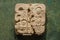 Ancient mayan glyph symbol engraved in rock