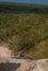 Ancient Mayan pyramids in the jungle Coba. Sun rays and scattered light. Yucatan, Mexico.