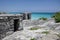 Ancient Mayan ruin perched on a rocky shoreline