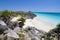 Ancient Mayan ruin perched on a rocky shoreline